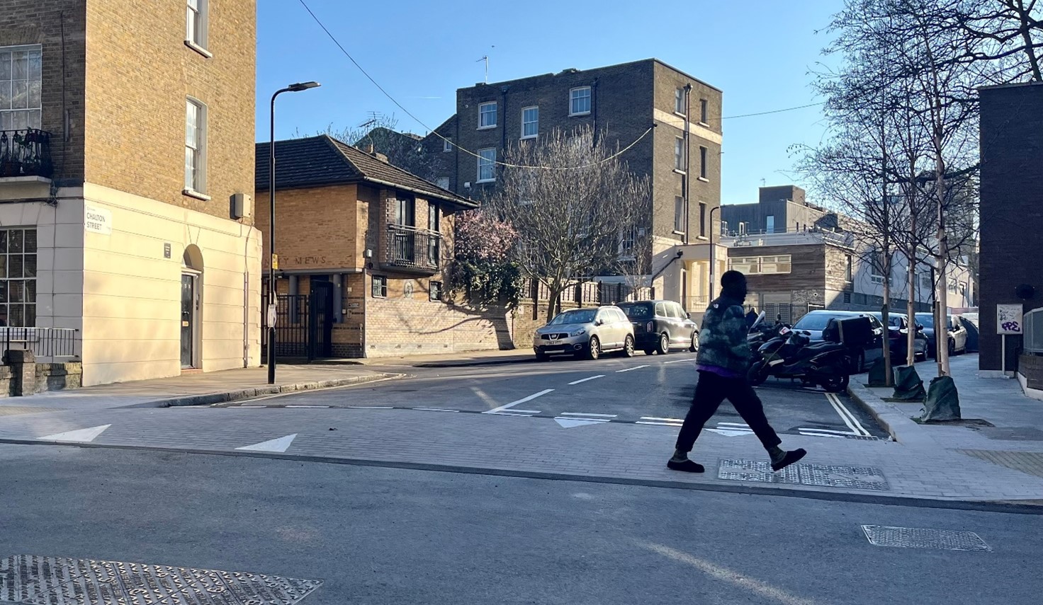 Image of continuous crossing, showing where the street is raised to pavement level and paved across the junction