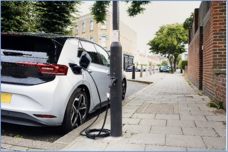 An Ubitricity lamp column charge point where a car is charging connected to a lamp post