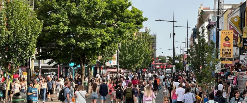 A busy Camden High Street with people walking where there was a road