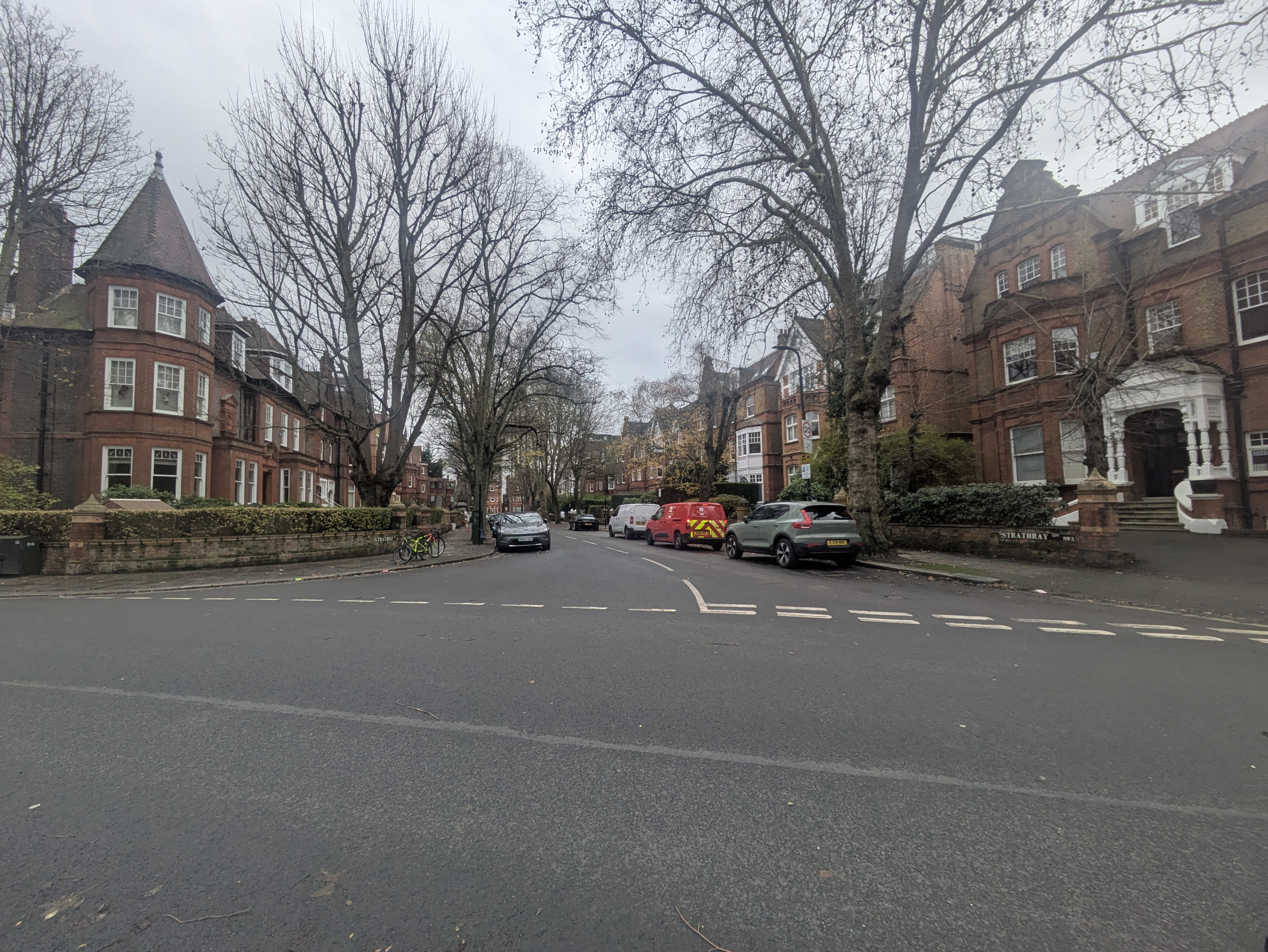 The wide junction with parked cars