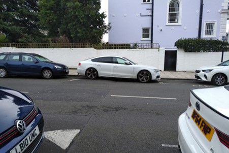 steep speed hump in the middle of the road