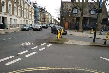 Junction with a pedestrian space in the middle of the road