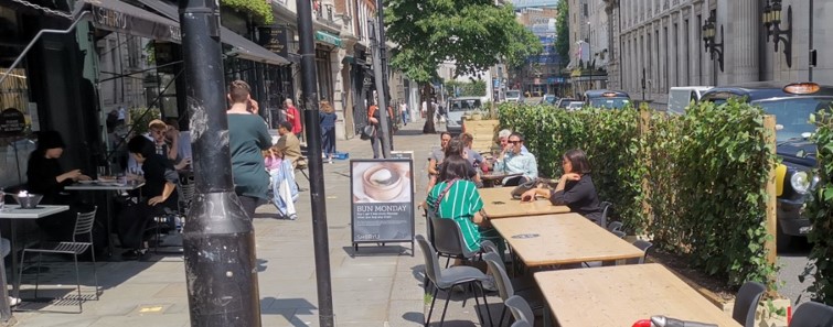Great Queen Street Streateries - people eating outside in a space created from the road