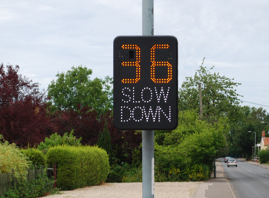 Sign showing 36 miles per hour and "slow down"